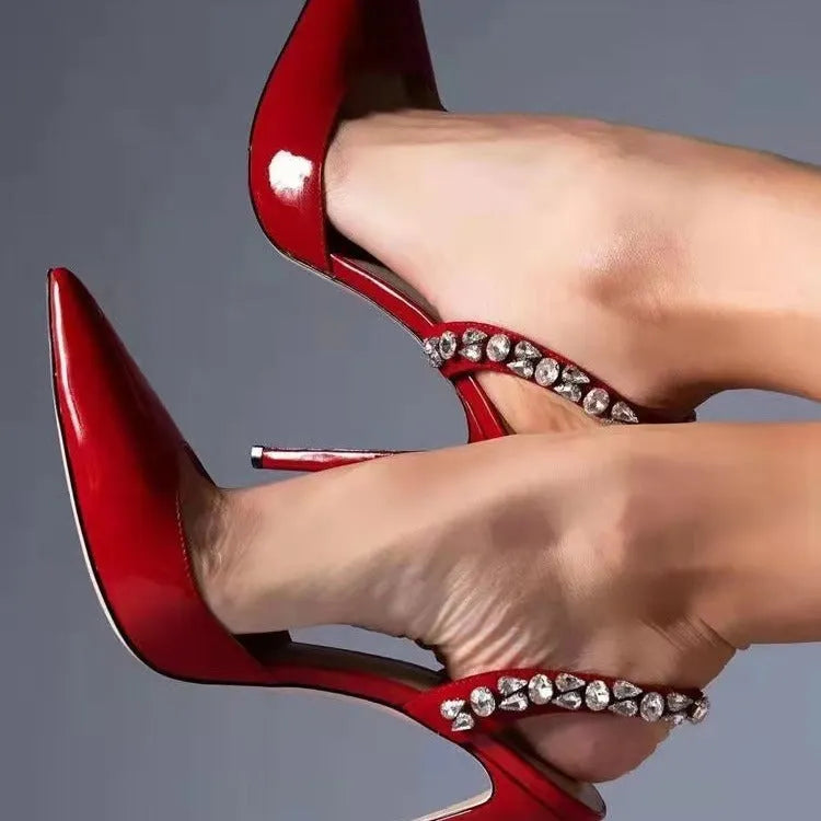 Pointed toe high heel sandals with rhinestone decoration on the side, in patent leather.