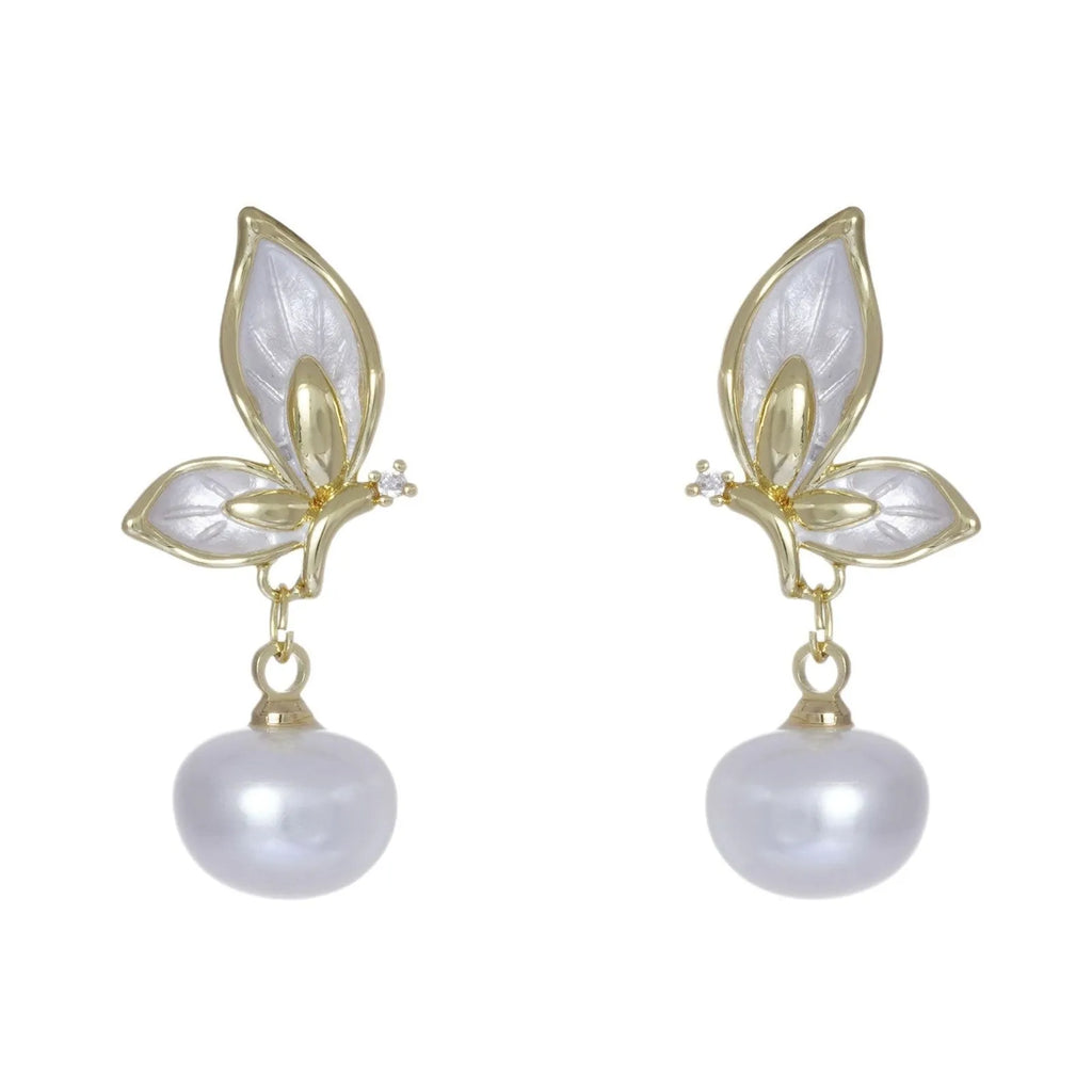 Close-up of zircon painted butterfly stud earrings on copper with electroplated finish