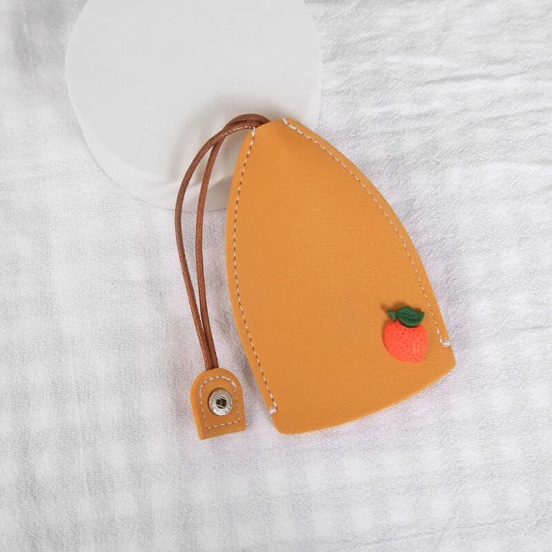 Cartoon design pull-out car key case made from soft PU leather, showing approximate size.