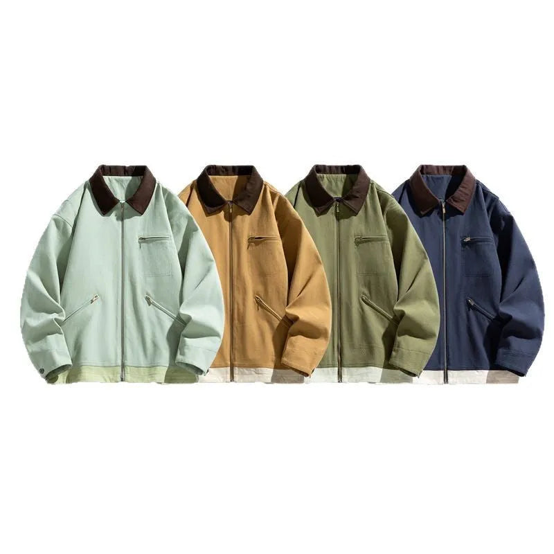 Man wearing a mint green retro workwear jacket with dark contrast lapels and side pockets.