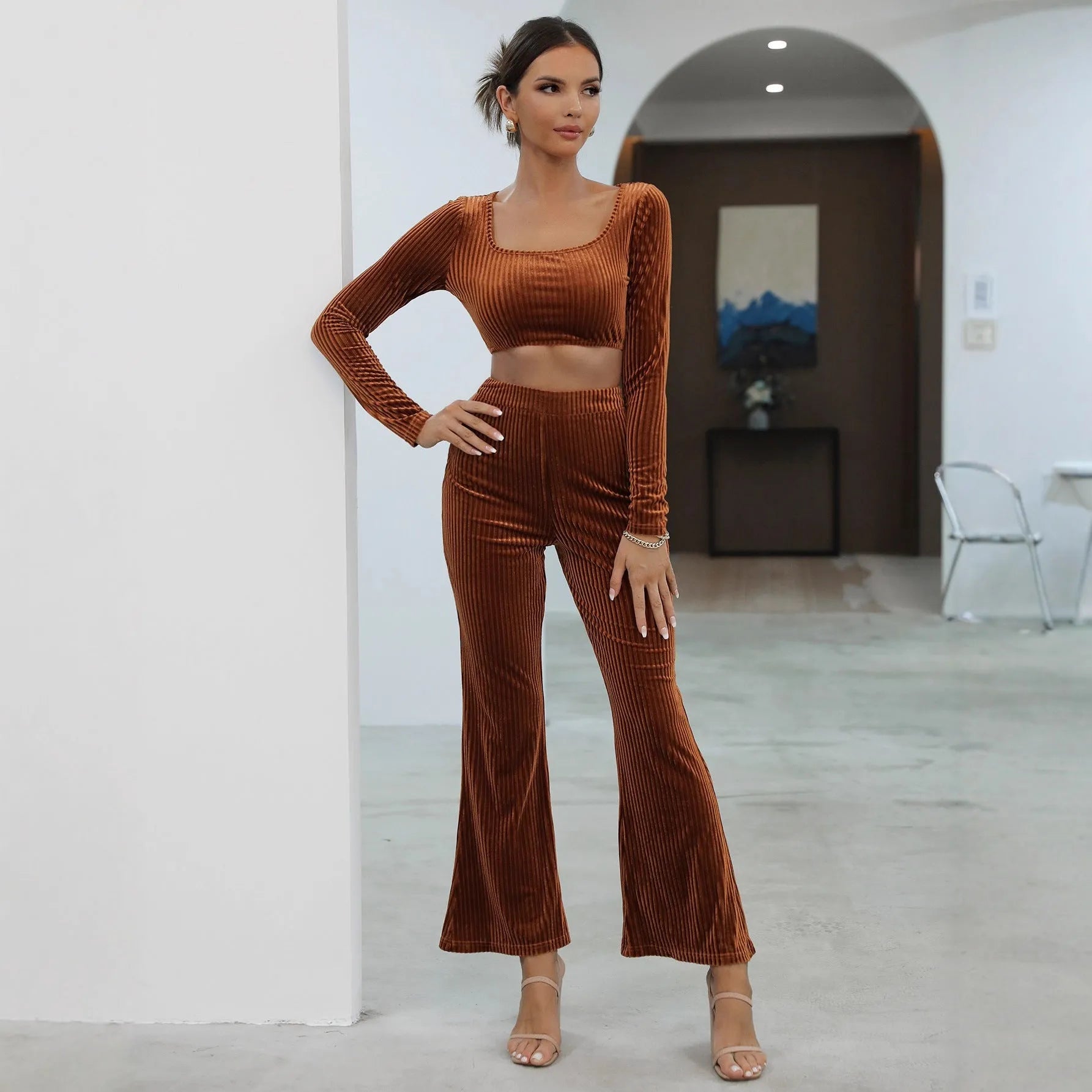 Caramel coloured women's long sleeve sweater and jogger lounge set laid flat.