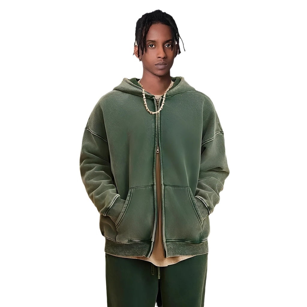 Man wearing a washed black fleece-lined cotton hooded cardigan with a double zipper.