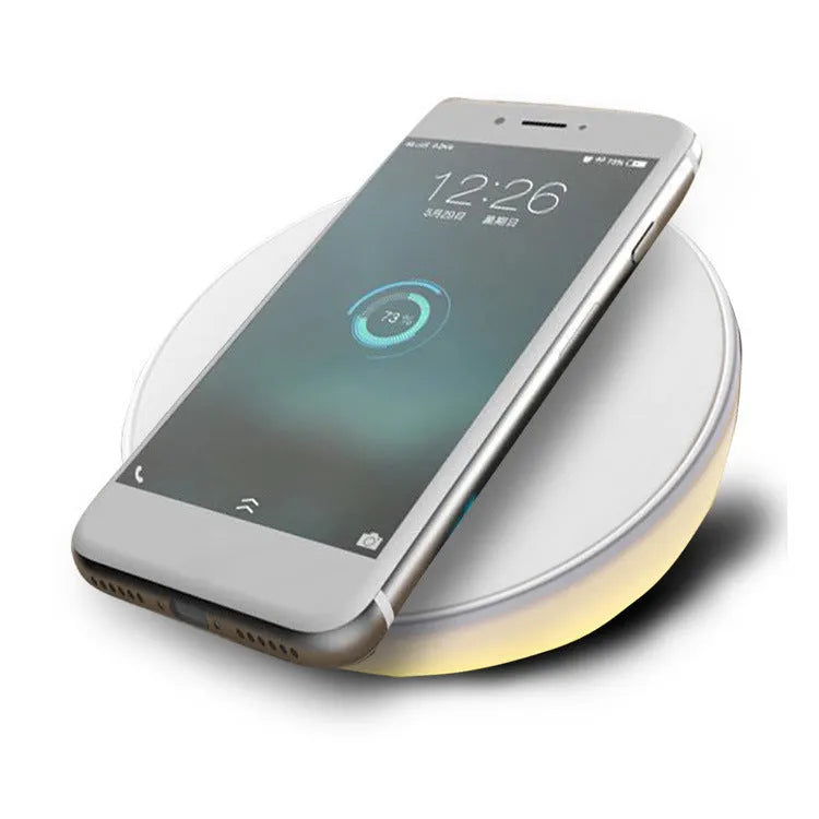 White wireless charger with digital clock display and three control buttons for mobile phones