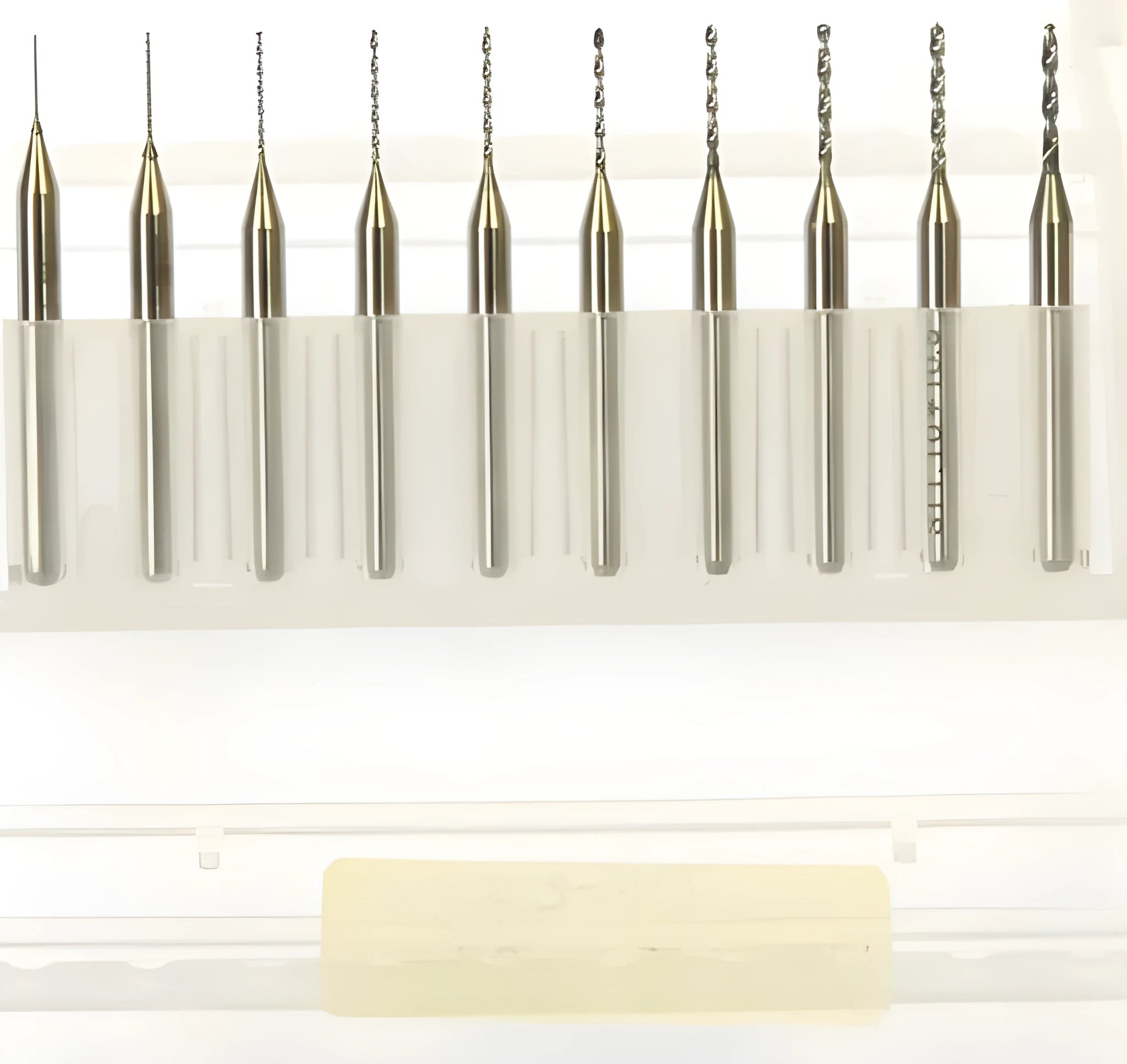 Imported tungsten steel micro engraving bit set with diameters from 0.10mm to 2.00mm for precision machining.