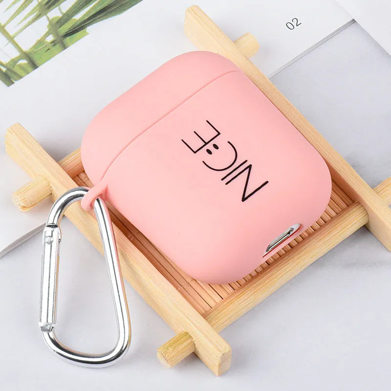 Black and pink AirPods case covers with floral and smiley face decorative patterns