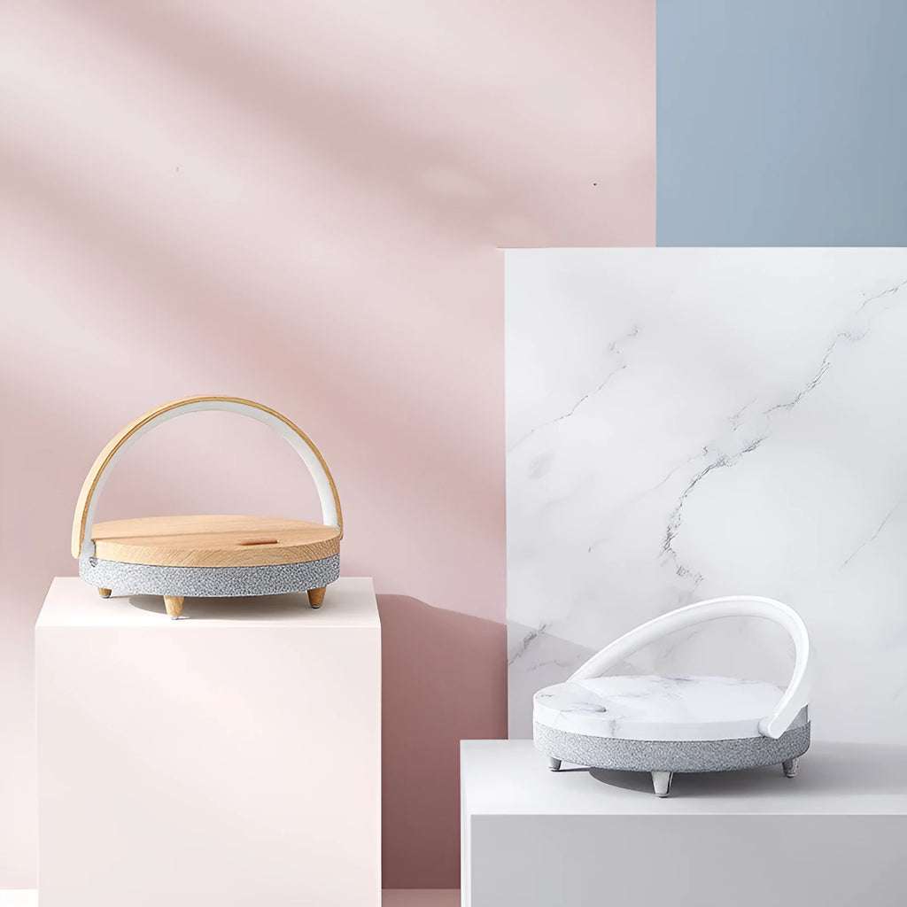 Marble pattern wireless charging LED night light with Bluetooth speaker and integrated mobile phone holder.
