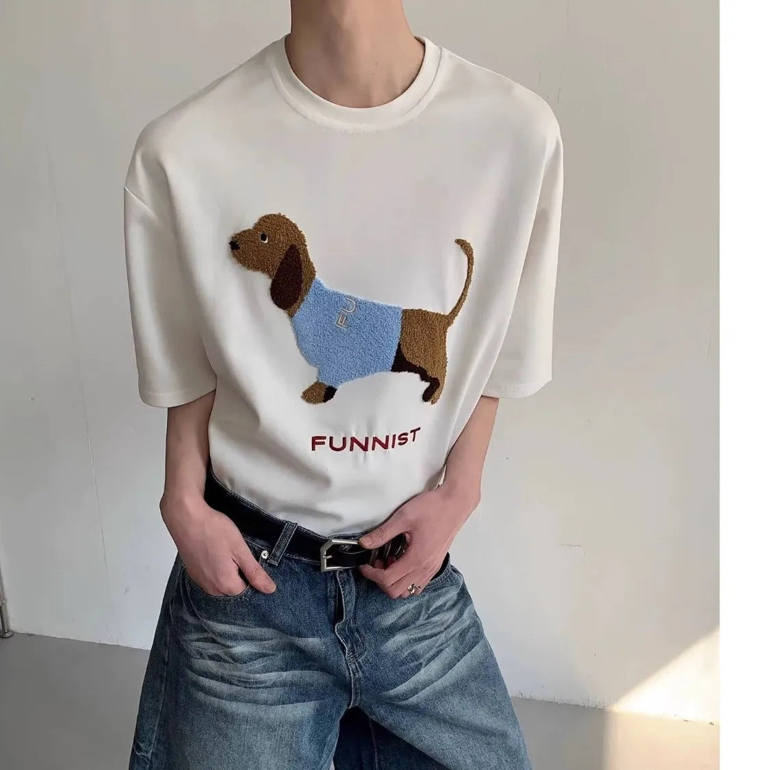 Men's grey cotton t-shirt with an embroidered black and white dachshund dog design on the chest.