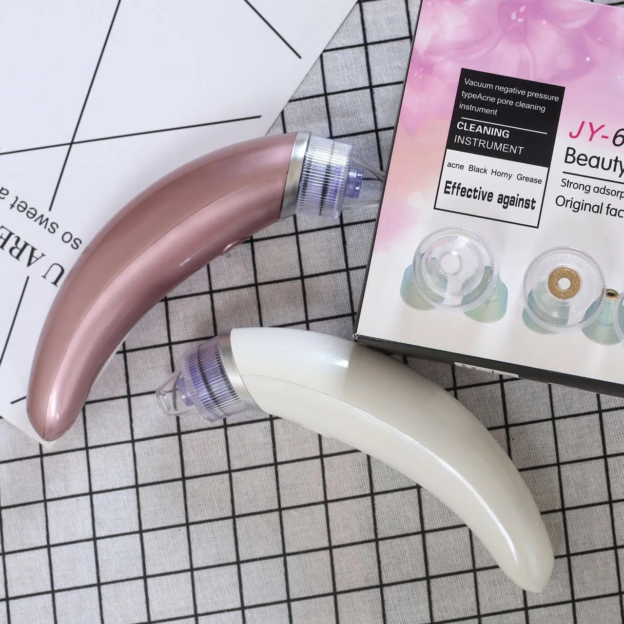 JY-666 rose gold and white electric blackhead suction pore cleanser tool.