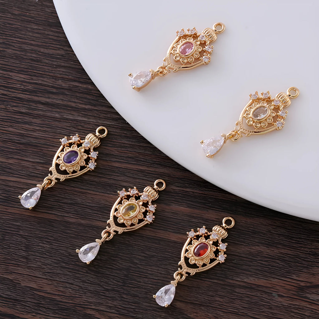 Water drop pendant with micro inlaid zirconia in five colour options showing 12mm x 23mm dimensions