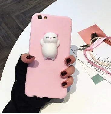 Soft silicone TPU iPhone case with a raised 3D cartoon cat design, shown in various colours.