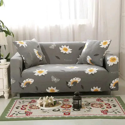 Geometric abstract printed stretch sofa slipcover covering a three-seater sofa with matching cushion covers.