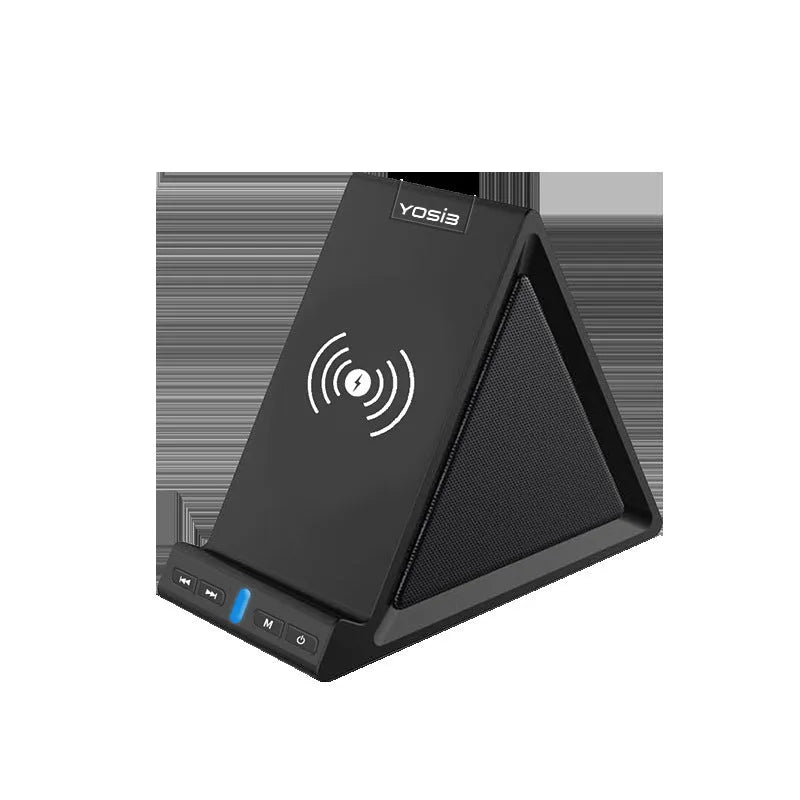 Black ABS Bluetooth speaker with integrated wireless charging pad and phone stand, shown on a desk.