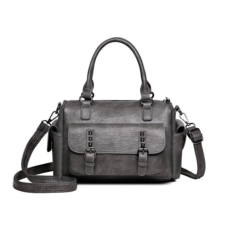 Vintage-style large messenger bag in PU leather, showing horizontal square shape and contrast stitching.
