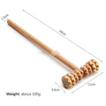 A selection of natural beechwood massage rollers including T-shaped and multi-wheel designs on a wooden surface.