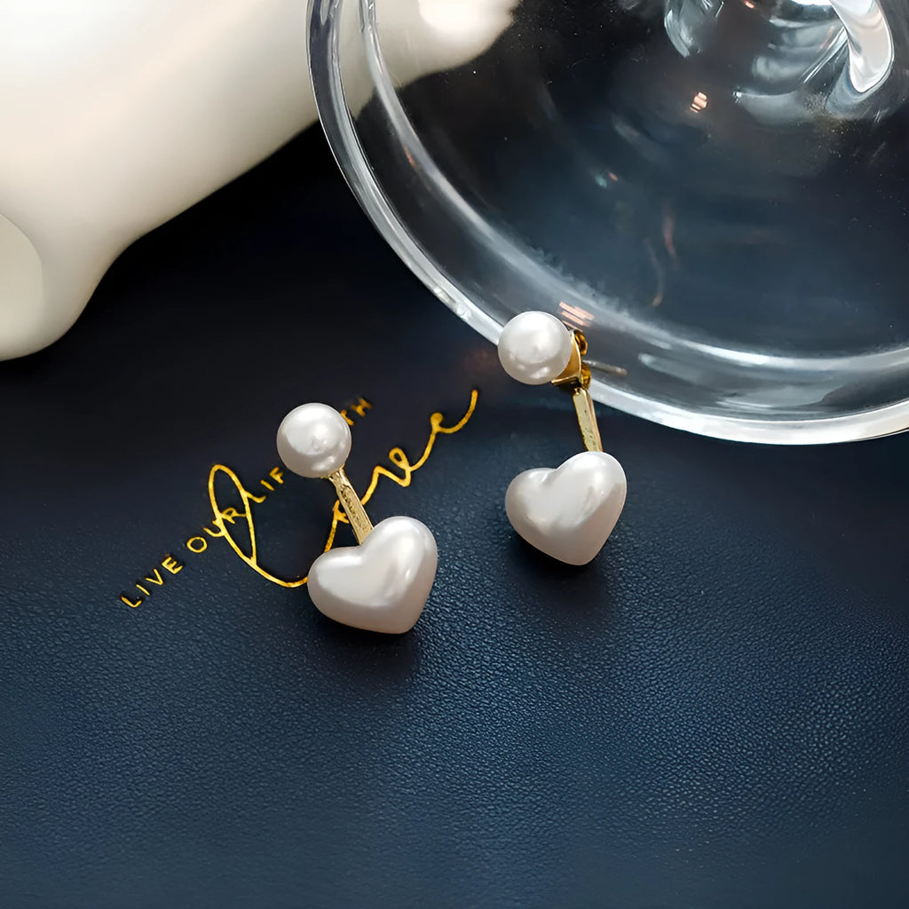 Women's heart-shaped pearl stud earrings with alloy inlaid gems and an electroplated finish.