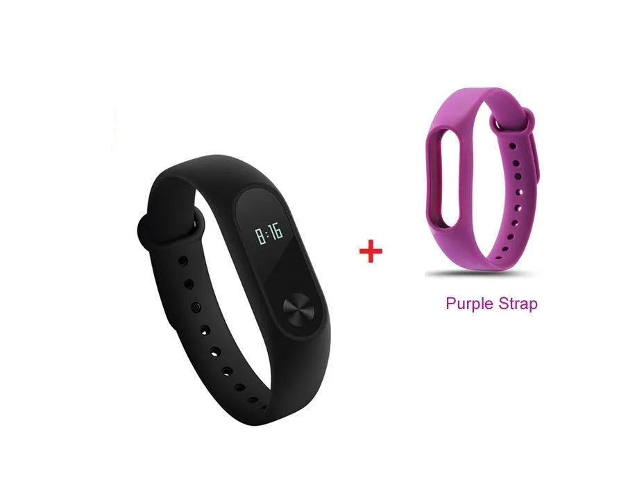 Black Xiaomi Mi Band 2 fitness tracker on wrist showing OLED display with heart rate data.