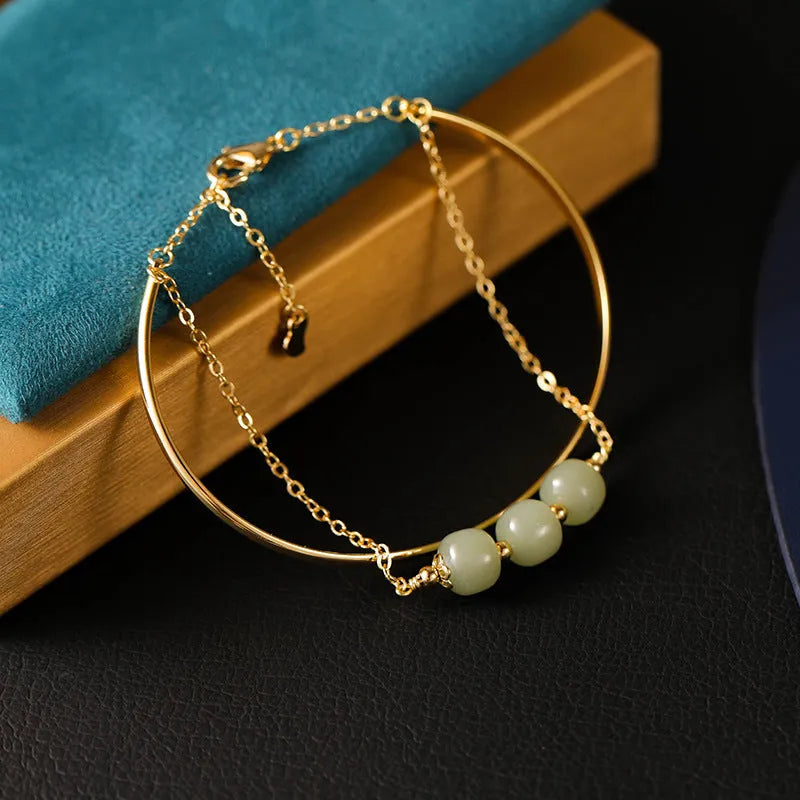 Women's Hetian jade lucky beads bracelet with gold inlay in single, double, and three-bead versions.