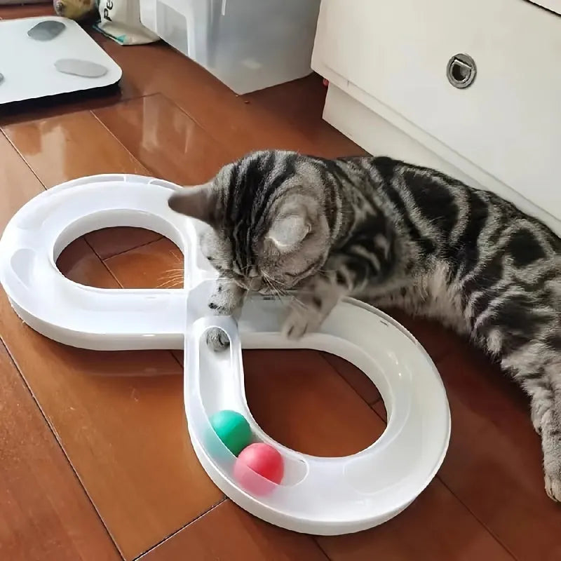 Blue and white circular cat turntable track with four spinning balls and teasing stick for feline play