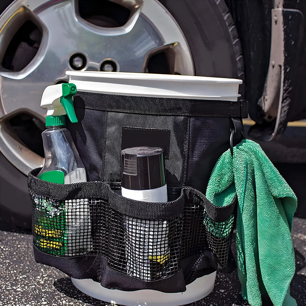 Black cylindrical polyester hanging storage bag shown fitted on a 5 gallon barrel.