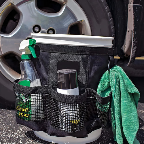 Black cylindrical polyester hanging storage bag shown fitted on a 5 gallon barrel.