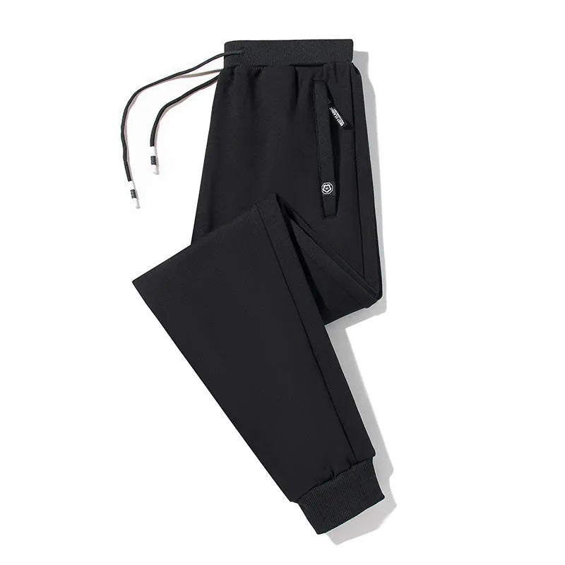 Plum Label men's large size cotton drawstring sweatpants in flat black, loose closed leg style