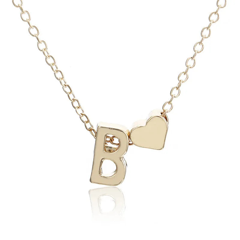Peach heart shaped pendant with initial letter in gold or silver alloy jewellery