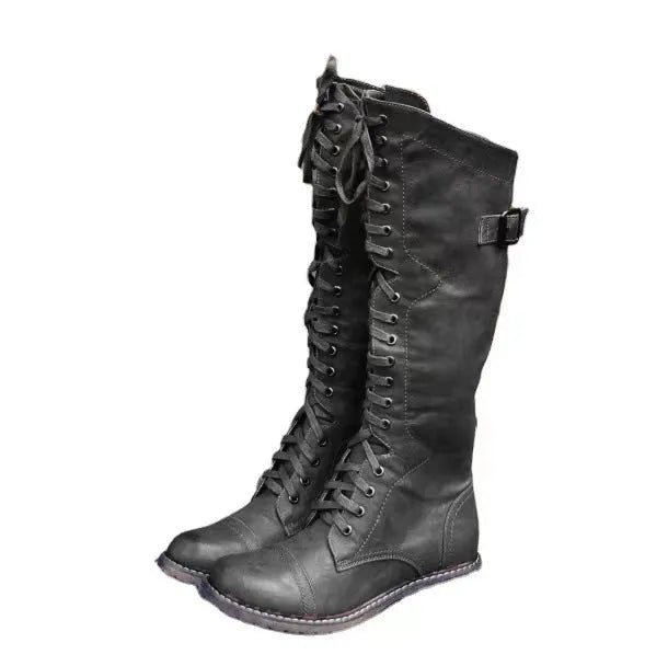 Women's black chunky heel high leg ankle boots on a white background.