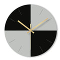 Large transparent tempered glass wall clock with minimalist numerals on a white wall.