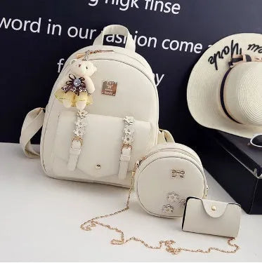 Women's three-piece backpack set with floral design including backpack, shoulder bag, and card holder