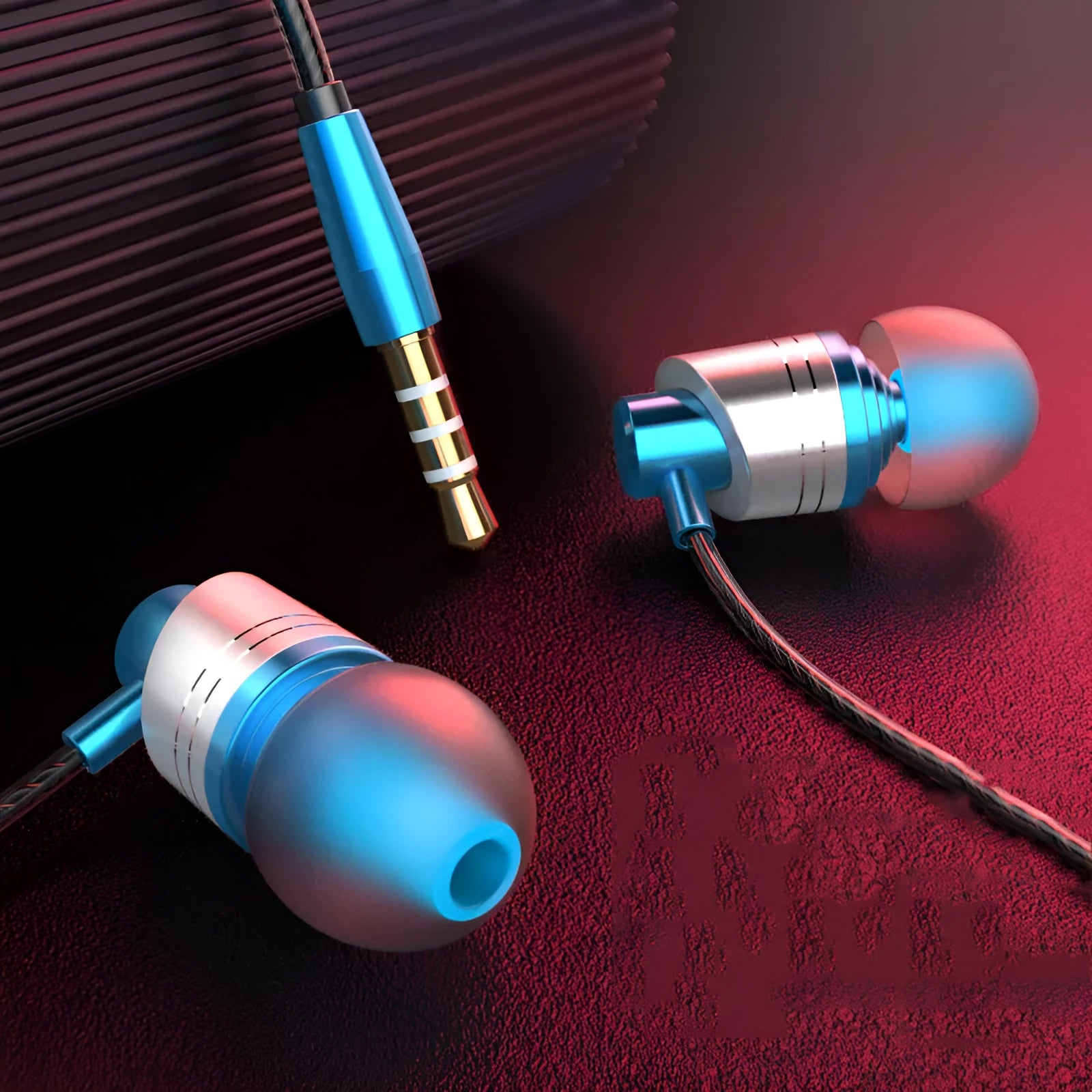 Black wired in-ear headphones with a 3.5mm plug, microphone on cable, and three pairs of silicone ear tips
