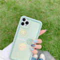 Green TPU iPhone case featuring a geometric smiley face and polka dot frame design.