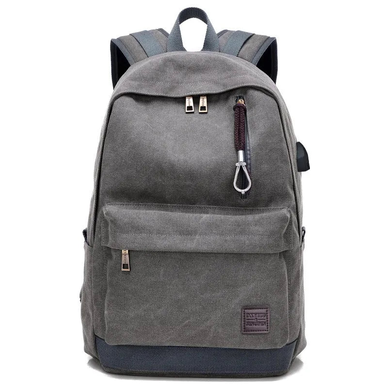 Canvas USB rechargeable backpack with laptop compartment showing multiple storage pockets