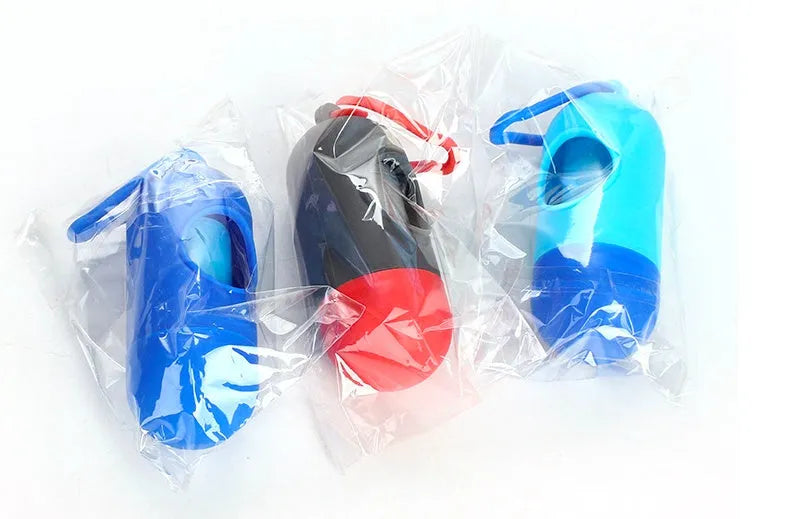 Roll of biodegradable dog poop bags showing multiple colour options including black, blue, green, and pink.