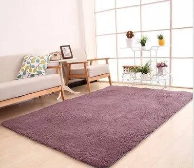 White plush rectangular area rug with a dotted non-slip bottom, shown at 40cm x 40cm size.