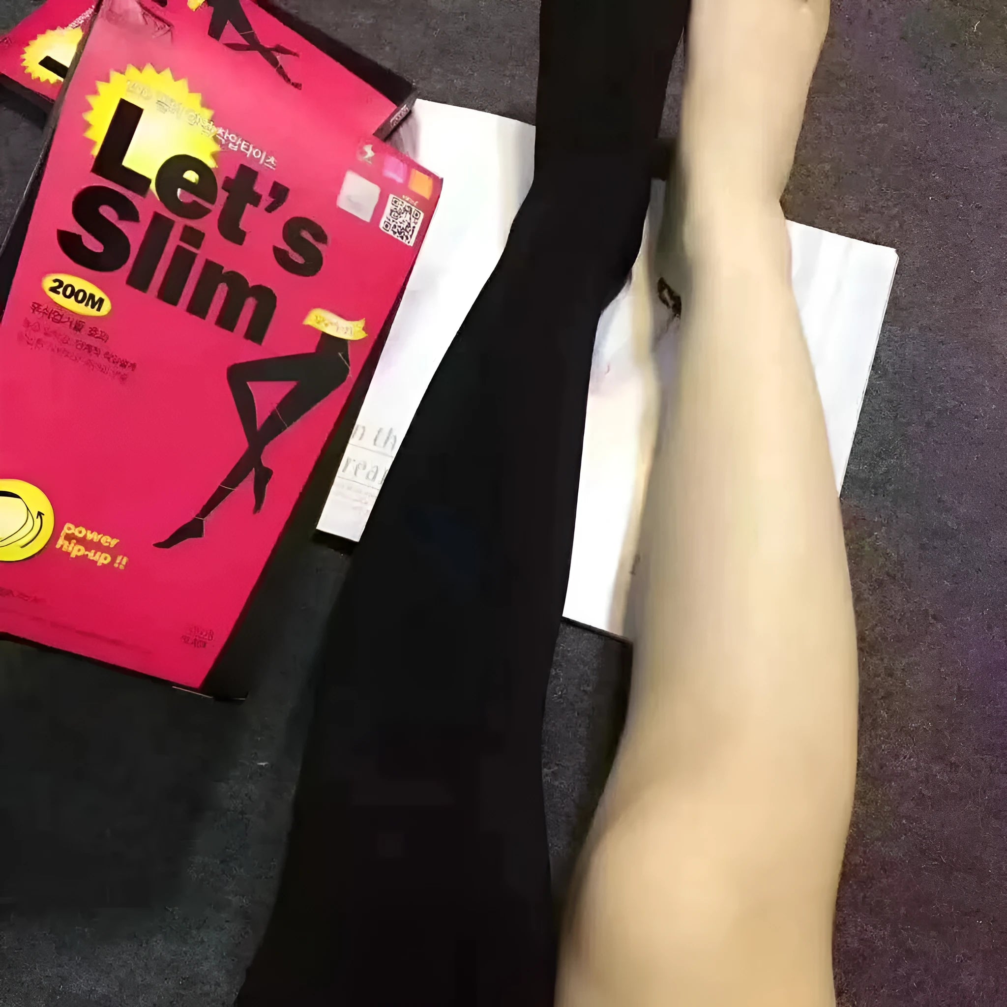 Beige and black lifting hips and abdomen stovepipe socks made from polyester fibre.
