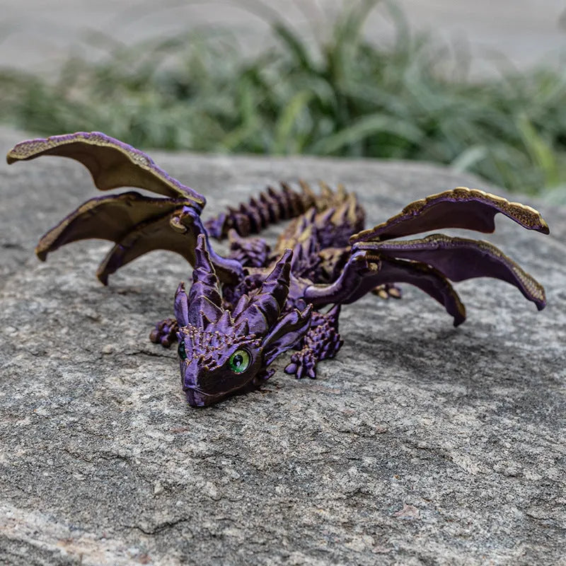 Red and gold 3D printed dragon wings toy decoration on a white background.