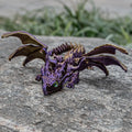 Red and gold 3D printed dragon wings toy decoration on a white background.