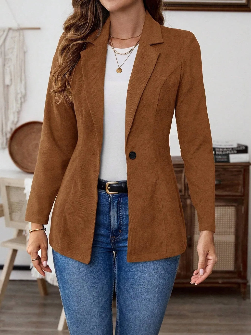 Brown men's single-breasted suit coat with lapel collar and long sleeves.