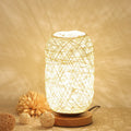 Sepak Takraw ball desk lamp made of brown hemp rope on a wooden base with USB cable