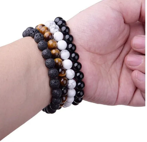 Geometric black agate bead bracelet on elastic cord, showing 8mm bead size.
