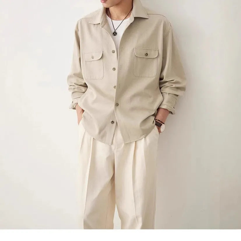 Men's simple lapel long sleeve shirt in light sand rice colour, cotton blend fabric, laid flat.