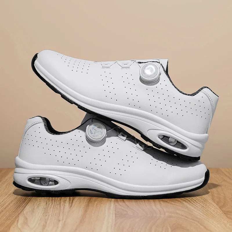 Black and white low-top mesh casual shoes with cross shoulder straps and a composite sole.