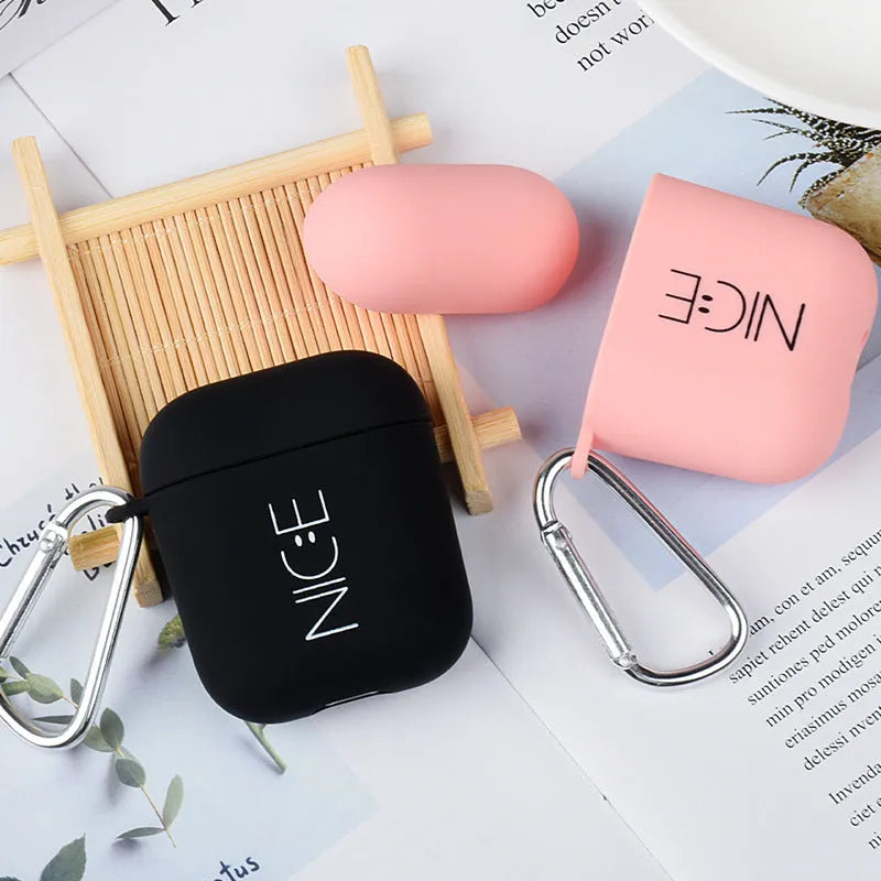 Black and pink AirPods case covers with floral and smiley face decorative patterns