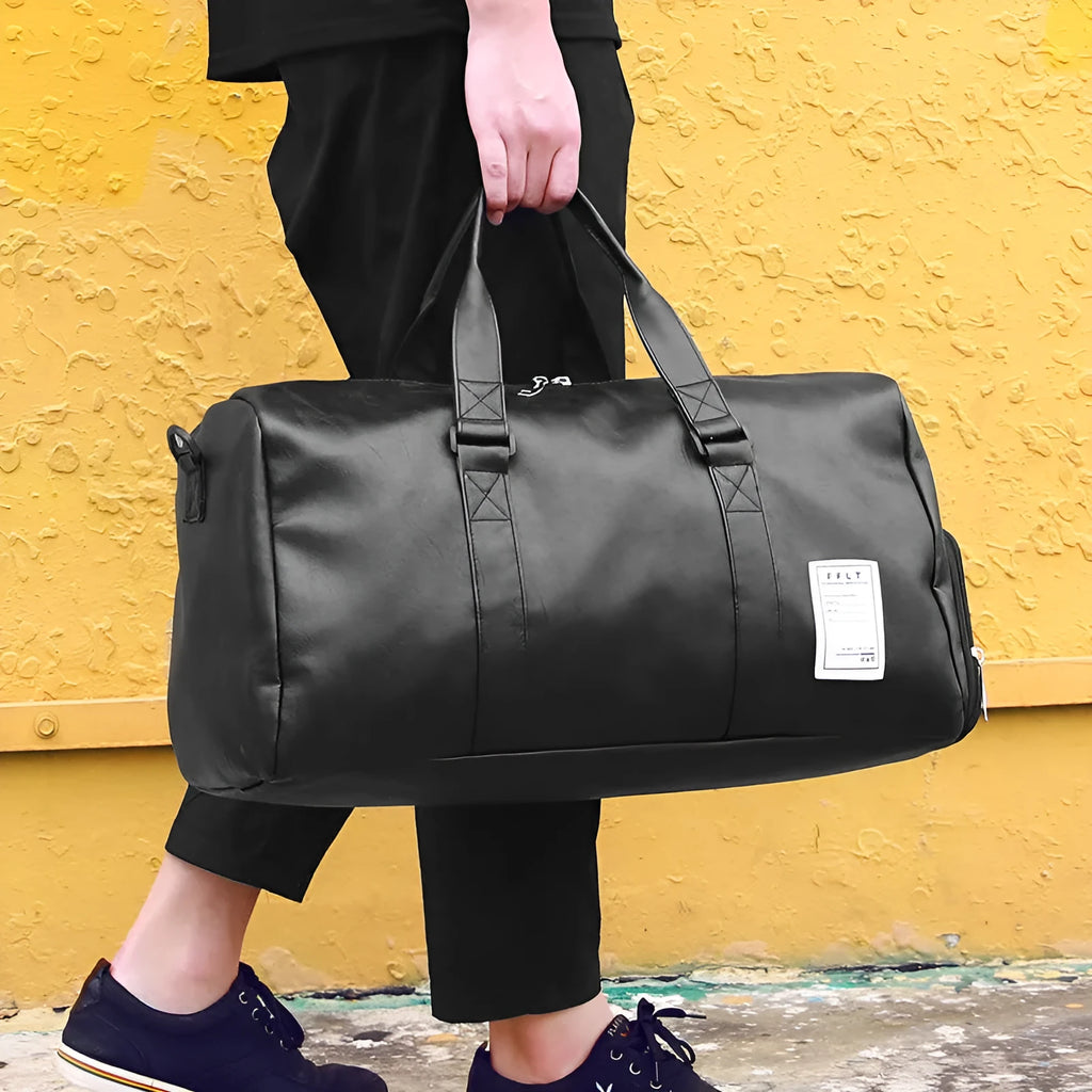 Black waterproof sports fitness bag with diagonal straps and separate internal shoe compartments.