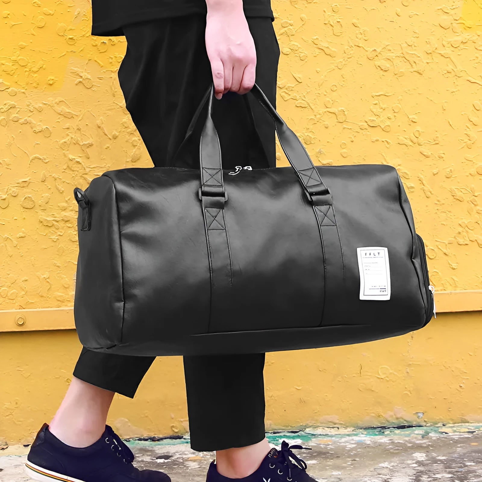 Black waterproof sports fitness bag with diagonal straps and separate internal shoe compartments.