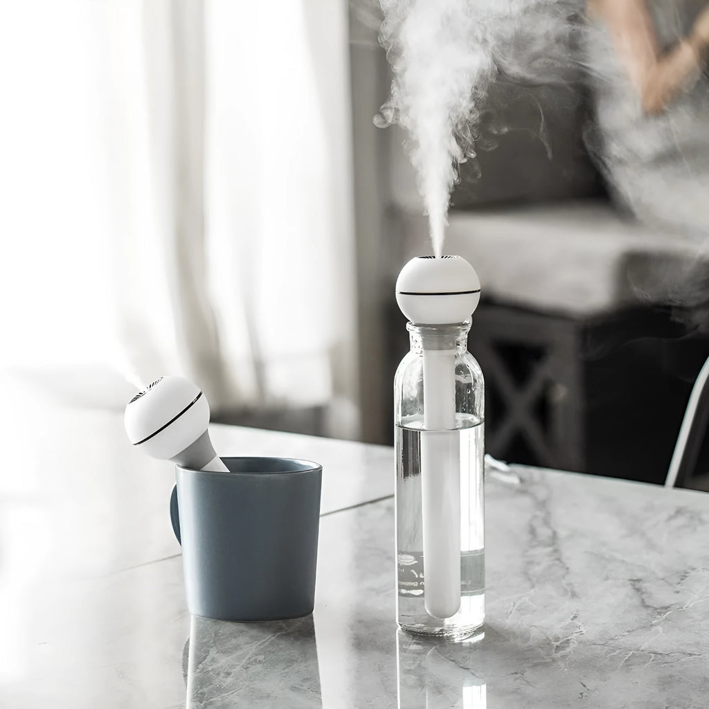 Columnar magic wand humidifier in pink or white with 1 litre tank and USB cable