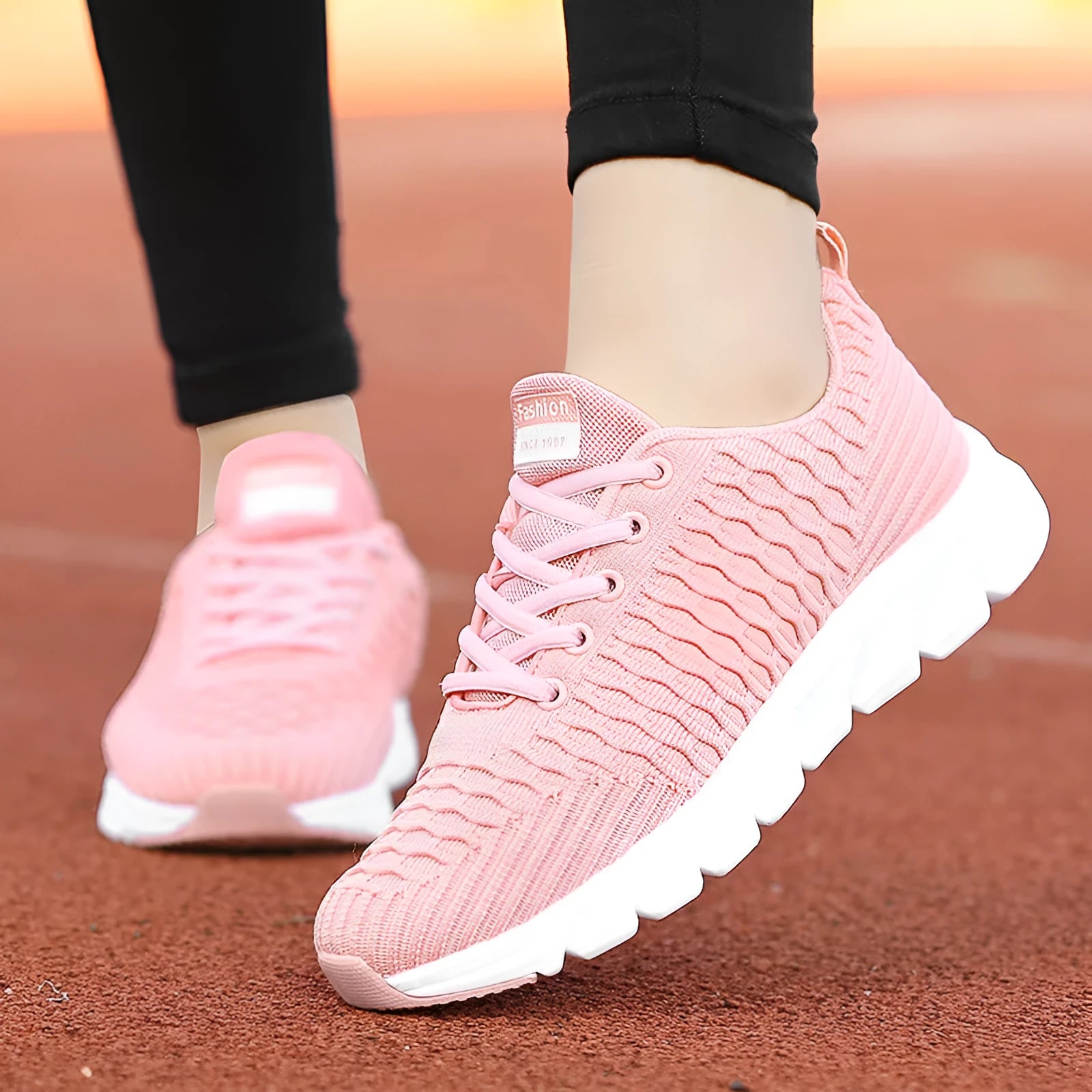 Women's running shoes with fly weaving upper in black, pink, or white colours.
