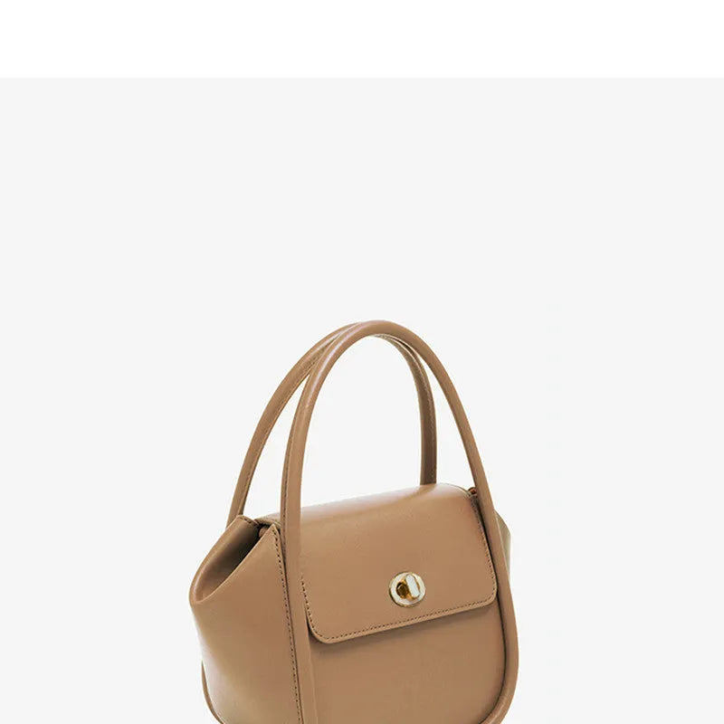 Women's leather wing-shaped tote bag with hard handle and cross-body strap in four colour options