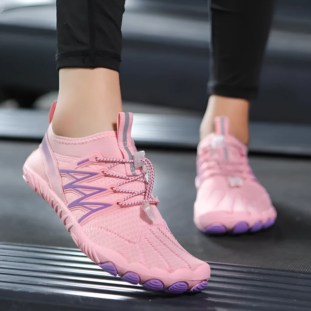 Lightweight indoor fitness training sneakers with low-top design and striped pattern.
