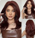 Mid-length curly full-head synthetic wig with long bangs in a platinum gradient colour.